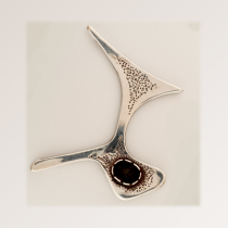 Bob Winston "Large Atomic Boomerang" Brooch, sterling with textured details and set with an oval onyx cabochon, marked, c. 1950's (Provenance: Celia Sebiri NYC)