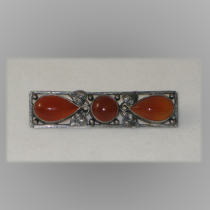 American Arts & Crafts "Leaf Motif" Bar Brooch, hammered sterling set with a round and two tear drop shaped orange agate cabochon jewels, marked, c. 1910