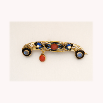 Austro - Hungarian "Secession" brooch, champlevé enamel set with cabochon moonstones and chalcedony in gilt silver, c. 1910