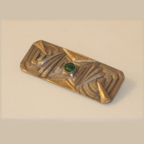 French Art Deco Brooch, sterling and gold overlay set with a round green jewel, c. 1930's