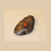 Fons Reggers (attr.) / Amsterdam School, Sterling with cabochon coral brooch, marked, c. 1920