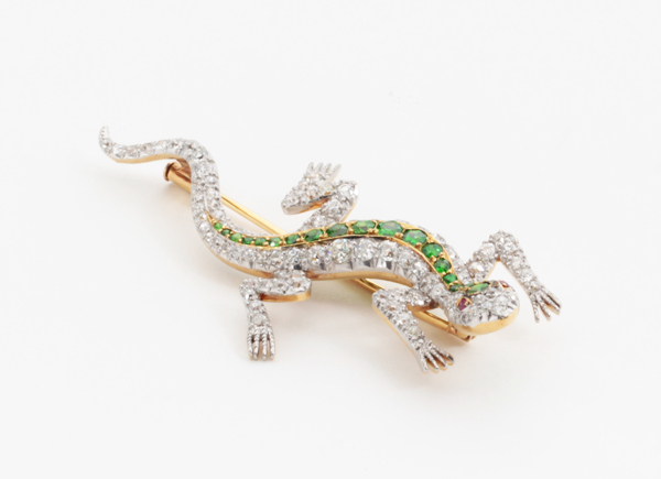 Shreve & Co. San Francisco, Lizard brooch with demantoid garnets and diamonds set in a platinum topped 18 K gold mount with 2 ruby eyes, signed, c. 1900