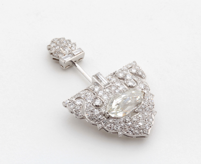 Cartier, Important  jabot brooch, fan shaped with round and baguette shaped diamonds (Indian Royal Briolette diamond, 6.11 carats, G.I.A. certificate) set in platinum, original leather box, signed, c. 1925