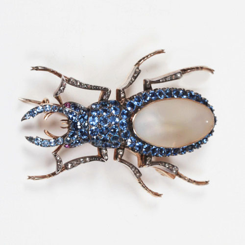 Belle Epoque “Staghorn Beetle” brooch, Montana sapphires set in white and yellow gold with a pearl back and 2 ruby eyes, c. 1900