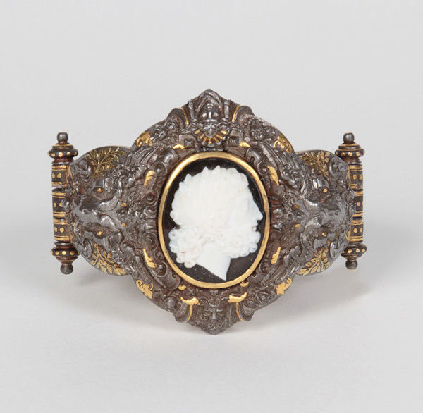 Boucheron “Renaissance Revival” cuff / bracelet, attributed to a design by Paul Legrand and made by Tissot, highly sculptural gold inlay, damascene steel set with an intricately agate carved cameo c. 1878