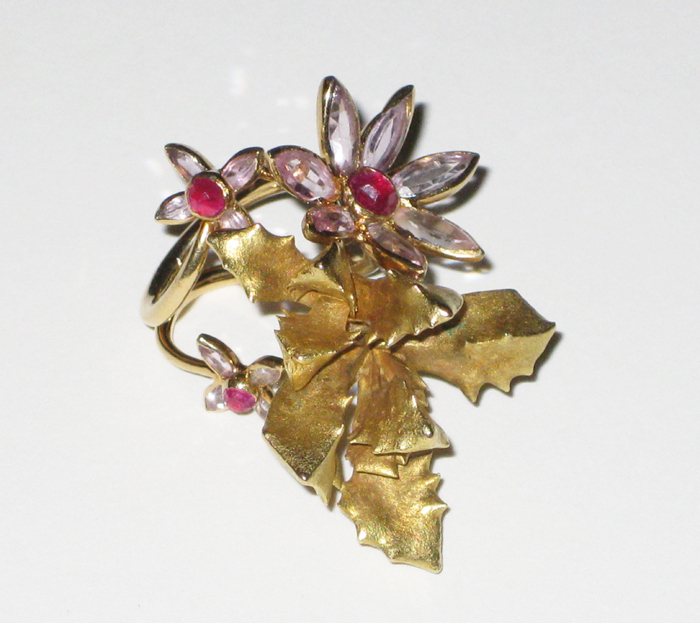 Jean Claude Champagnat, Paris (1923-1980) for the famous Couturier, Christian Dior (1905-1957) “Exotic Flower Blossom” ring in 18K gold with flower blossoms gemset with 3 round rose-cut rubies (approx. 2 carats TW) and 15 marquise shaped Kunzite flower petals, signed, c. 1950’s