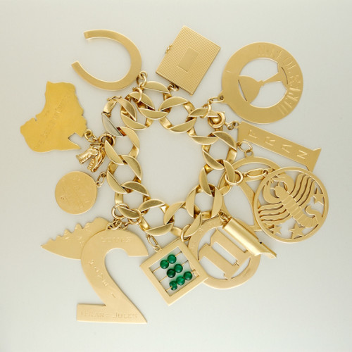 American “Retro” large charm bracelet on a squared curb link bracelet all in 14K gold, marks, c. 1940’s