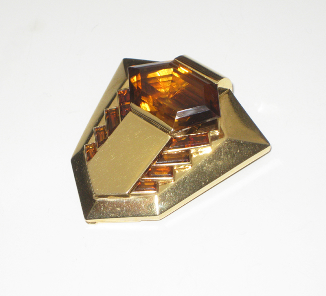 French Art Deco “Heptagon” clip / brooch set with a large fancy cut madeira citrine and 8 baguette madeira citrines all set in 18K gold, signed, c. 1935