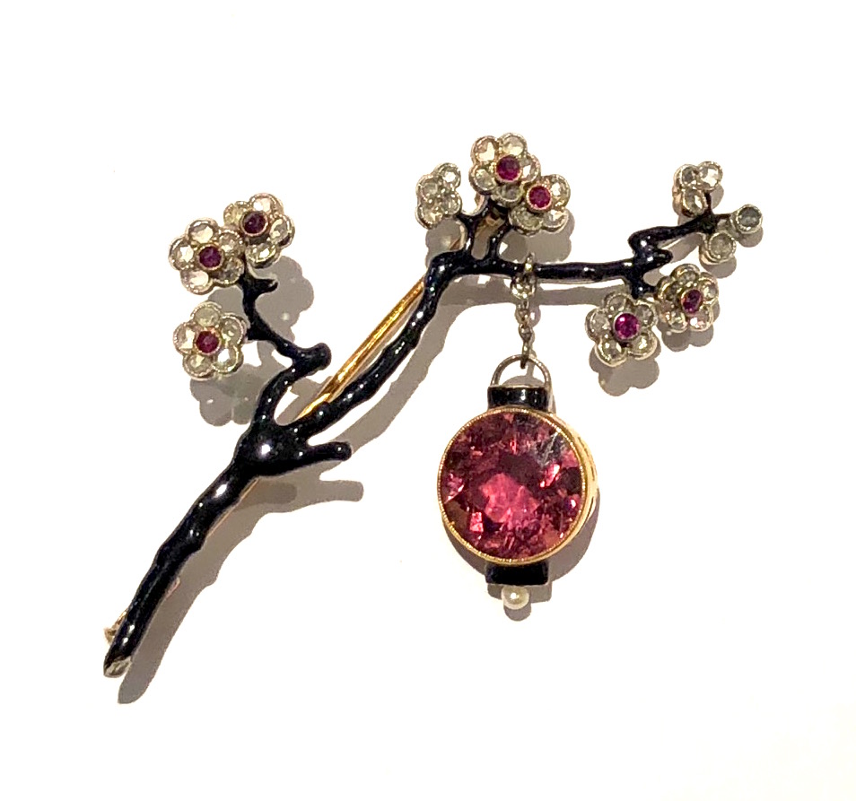 Sigmund Zuckermandl, Vienna, “Cherry Blossom” brooch, enameled 18K gold set with diamonds and pink tourmalines further set with a large round pink tourmaline as a hanging lantern and a pearl, signed, c. 1890