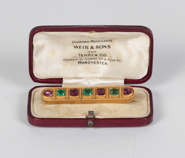 Etruscan Revival 18K gold brooch set with three square cut emeralds and four square cut rubies (approx. 7 carats TW), period box c. 1875