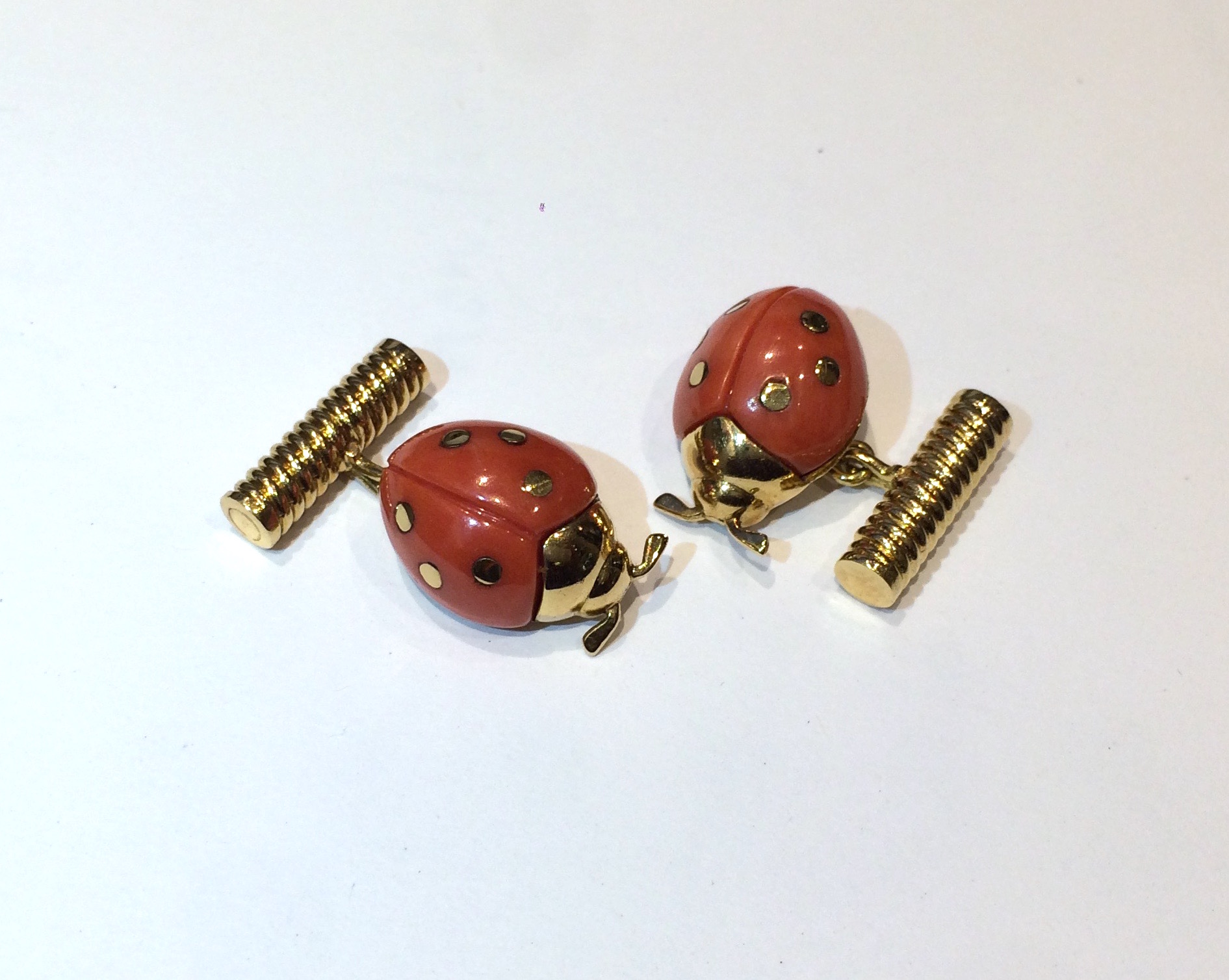 Cartier “Ladybug” cufflinks, coral and 18K gold, signed, 1950’s