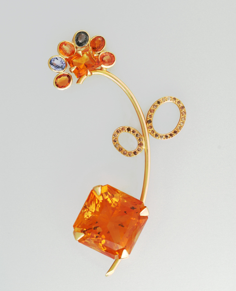 Mahrokh Beck, Munich, Stylized flower brooch with a large square cut citrine, a smaller square cut citrine, yellow and orange oval citrines, sapphires and cognac diamonds all set in 18K yellow gold, c. 2005