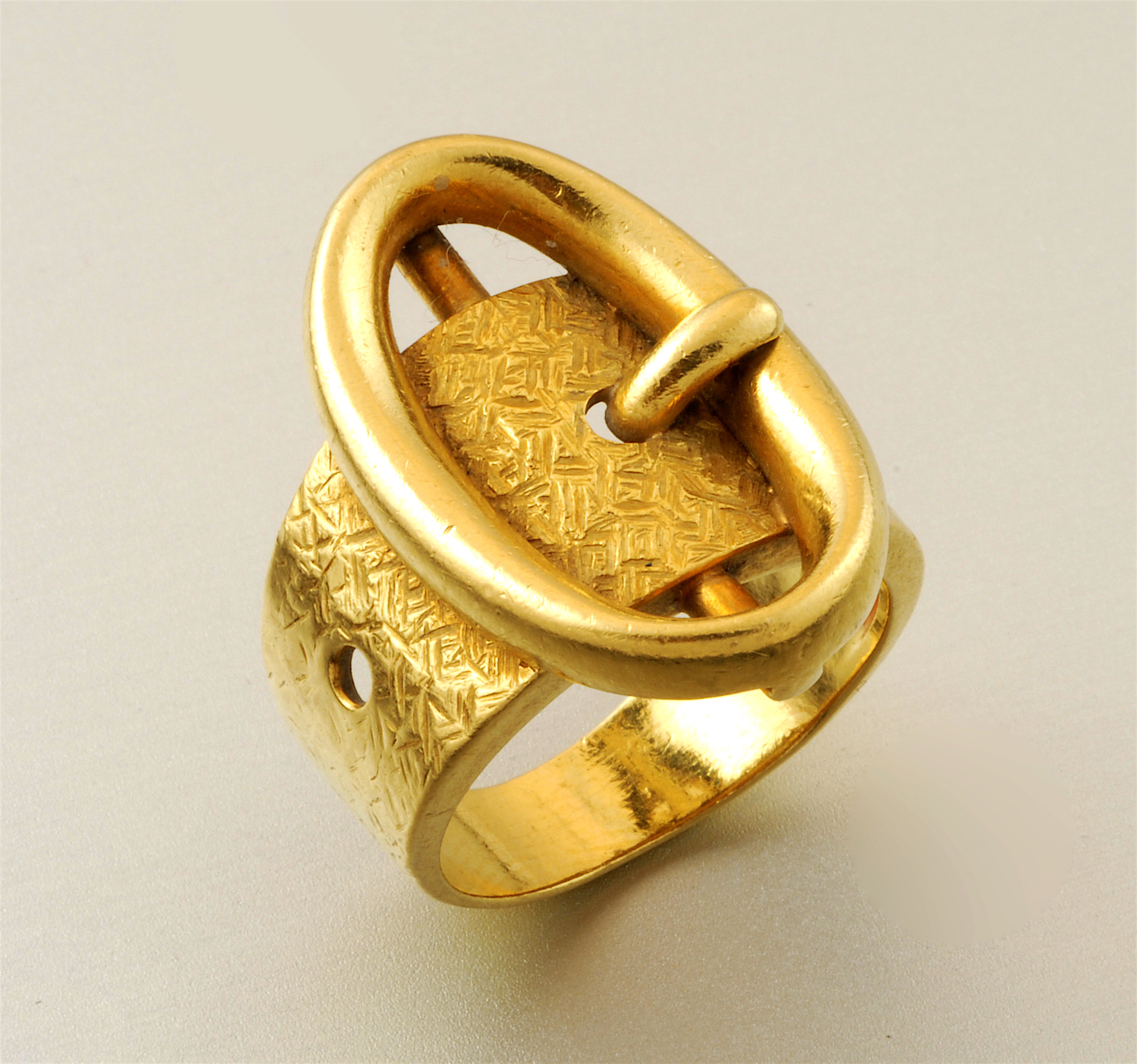 Italian Retro oval “Buckle” ring, 18K gold with a Florentine finish, marked, c. 1940’s