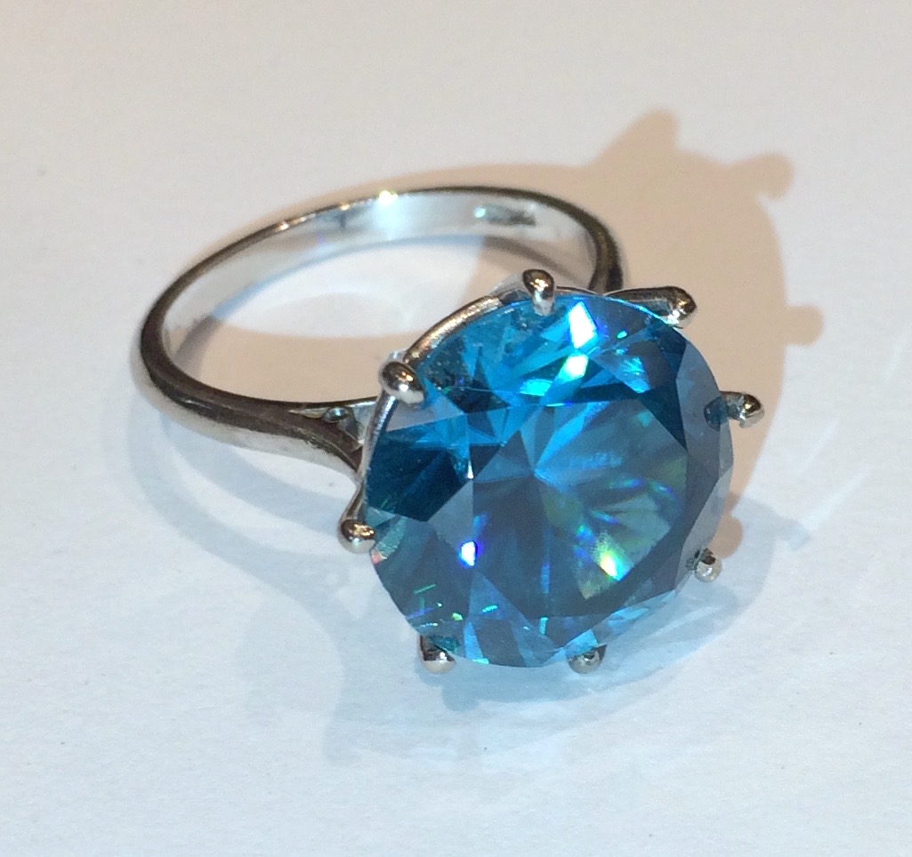 Art Deco round cut blue zircon ring (approx. 17 carats TW) set in platinum, marked, c. 1930