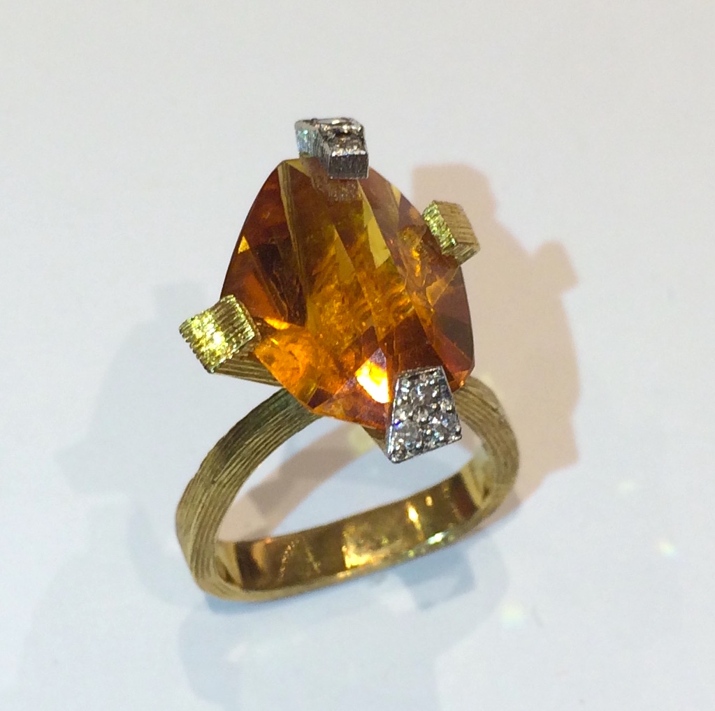 Andrew Grima “Comet” ring, Asymmetric cut citrine mounted in 18K textured yellow gold, five diamonds, signed: GRIMA, 0.750 (in a rectangle cartouche, AG Limited (in a rectangular cartouche), Crown, 18, Lion’s Head (for London), q (date mark for 1971), 1971