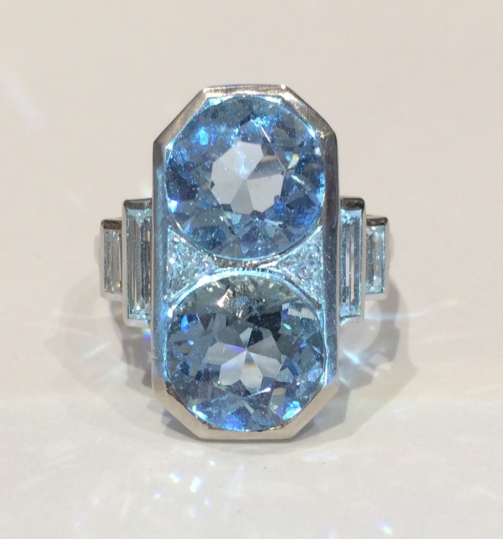 French Art Deco ring set with two round aquamarines (approx. 6 carats TW), two triangular shape and four baguette diamonds all set in platinum, signed,  c. 1930