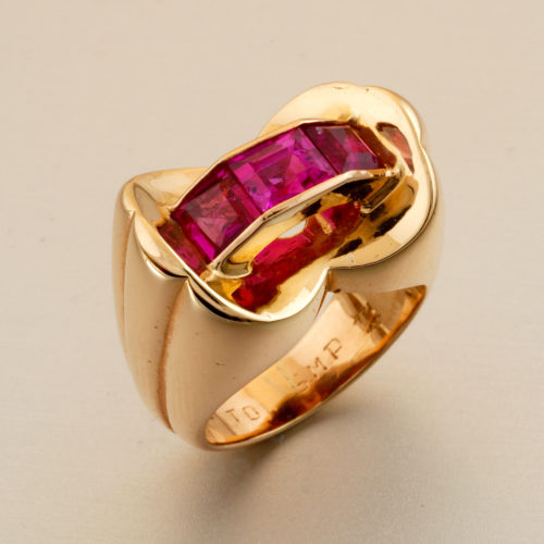 American “Retro Ruby” ring set with three square cut natural pink toned rubies (approx. 2 carats TW) in a 14K mounting, marked: RKV maker’s mark, 14K, inscribed with the initials H.R.P.to S.M.P., c.1940