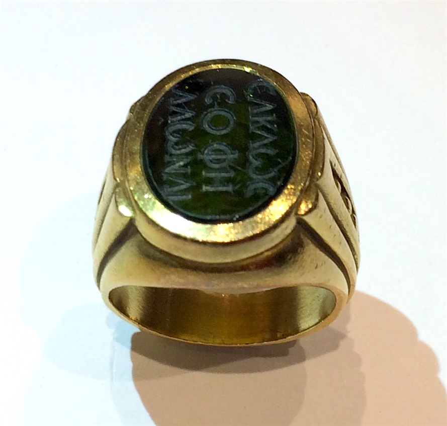 Barry Kieselstein-Cord Signet ring, Carved green tourmaline with Greek letters inset into a stylized 18K gold mount, signed, 1984