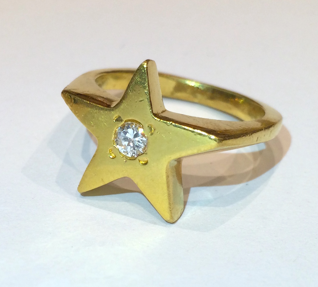 “Star” ring, 18K gold set with a round diamond, c. 2010