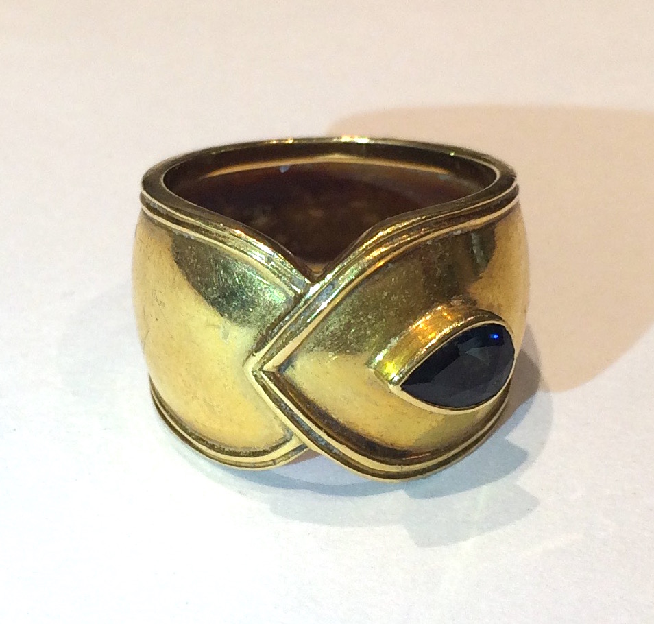 Italian 1970’s “Overlap design” ring, 18K gold set with a pear shaped sapphire (approx. 1 carat), marked