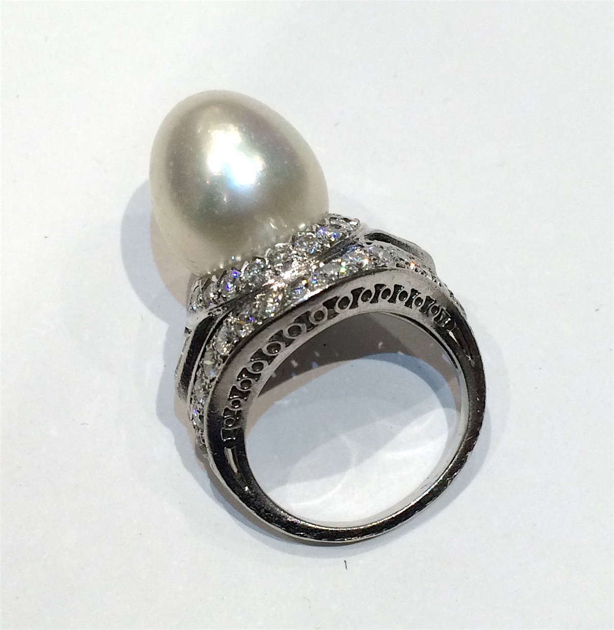 French 1950’s “Turban Style” ring, large pearl (G.I.A. certificate, Weight of the pearl: 16 grams, bead cultured pearl, saltwater, drop shape, white color, “Orient” overtone) and fancy diamond ring set with two triangle diamonds (approx. 2 carats TW) and 48 round diamonds (approx. 8 carats TW) all set in platinum, signed
