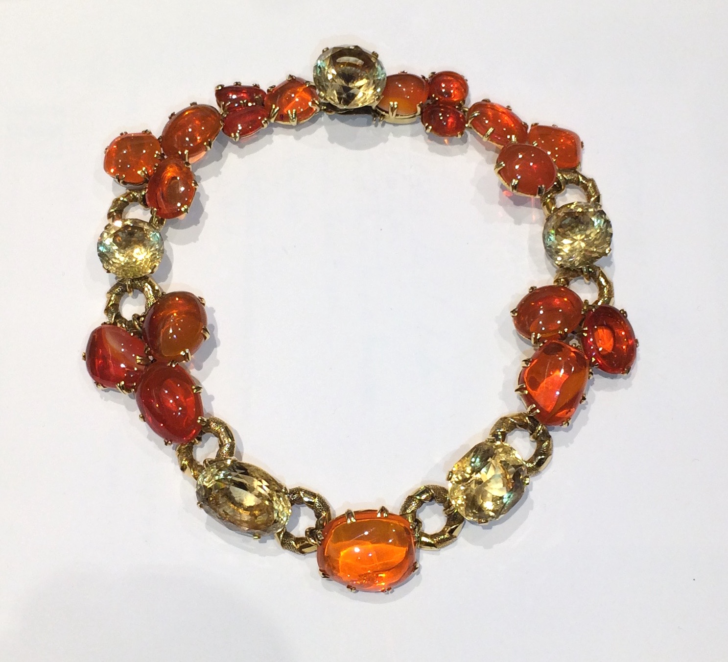 1940’s jeweled necklace, 18k gold textured ring links and elaborate bezel set 19 large cabochon fire opals (approx. 260 carats TW, ranging in sizes from 4 carats to 32 carats each) and further set with two oval cut citrines and three round cut citrines (approx. 145 carats TW, ranging in sizes from 22 carats to 36 carats each) c.1940