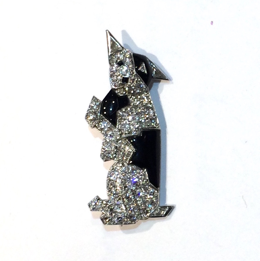 Udall & Ballou “Scottie” dog brooch set with 62 round cut diamonds (approx. 5 carats TW), two triangle shaped diamonds, one diamond shaped diamond, black enamel and onyx all set in platinum, c.1930