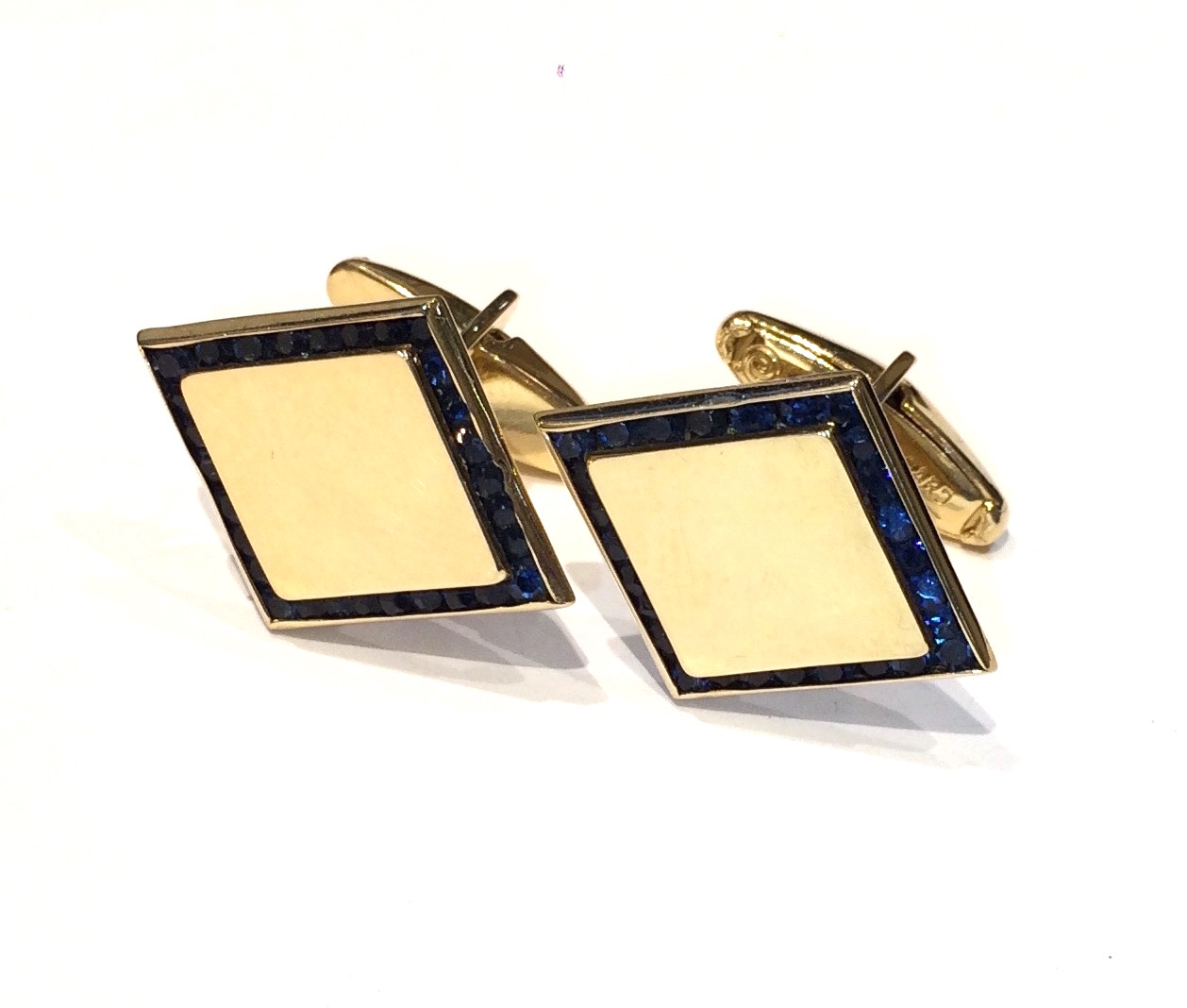 Lucien Piccard “Diamond” cufflinks, 14K gold set with 28 sapphires outlining the edge, signed, c. 1950’s