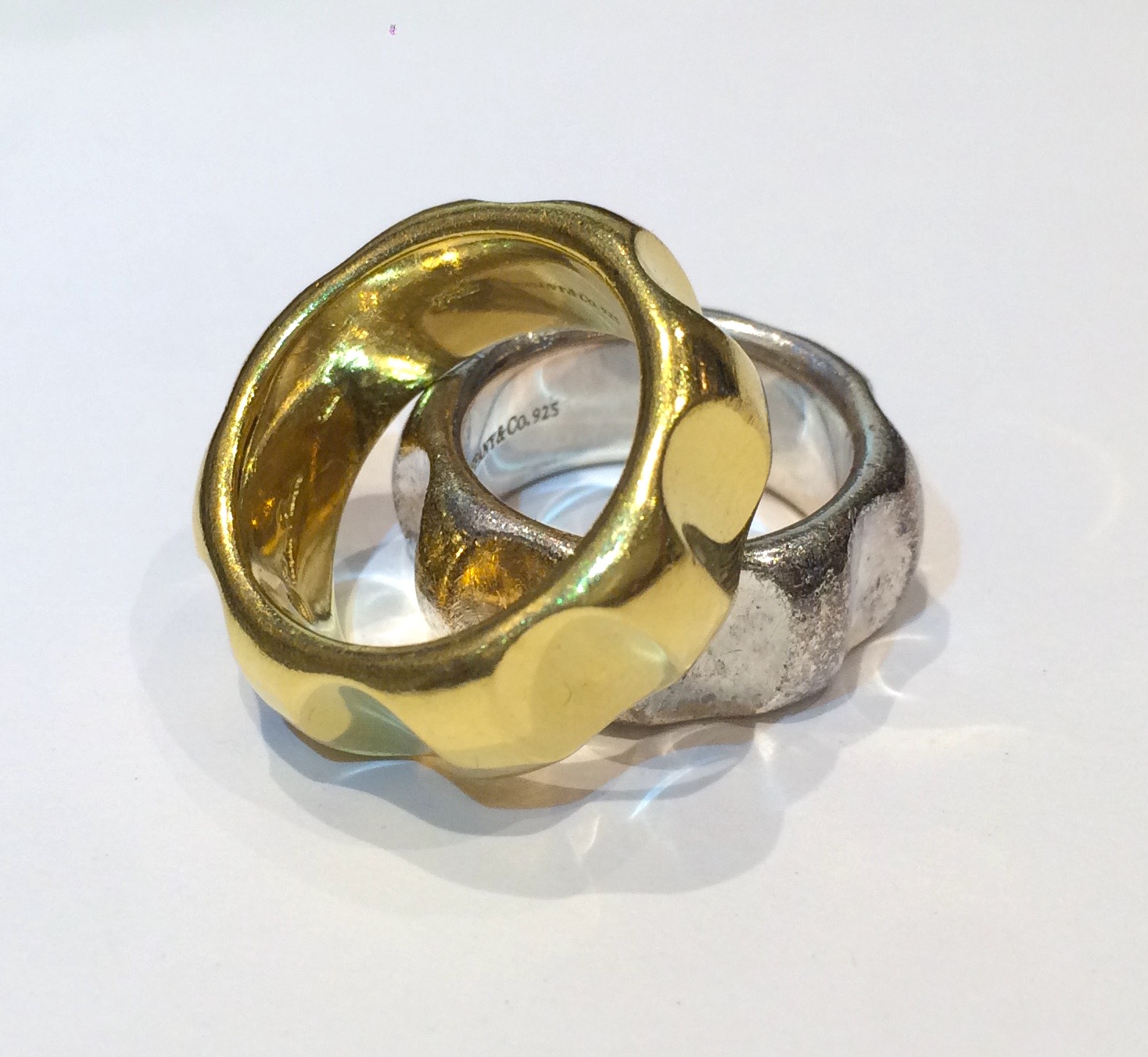 Paloma Picasso for Tiffany & Co. “Faceted” rings, one ring in 18K gold, the other in sterling silver, both signed, c. 1980’s