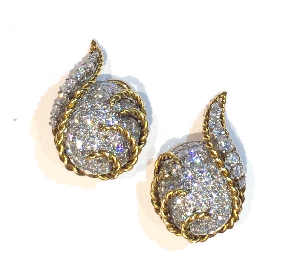 Hammerman Bros. (attr.) “Swirl” clip earrings, pave diamonds (approx. 8 carats TW) set in platinum with and 18K yellow gold backs and twisted wirework details, c.1940’s