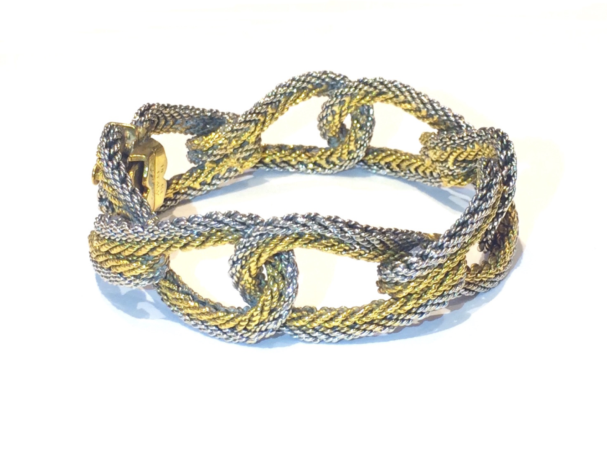Cartier “Woven Loop” bracelet, yellow and white 18K gold, signed, c. 1950’s