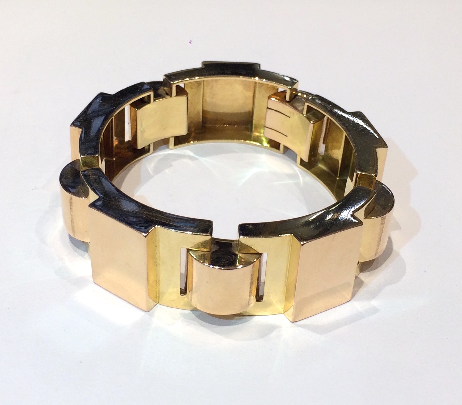 French Art Deco bracelet, 18k rose and yellow gold in a bold cylinder and contoured rectangular block detailed link design, c.1930’s