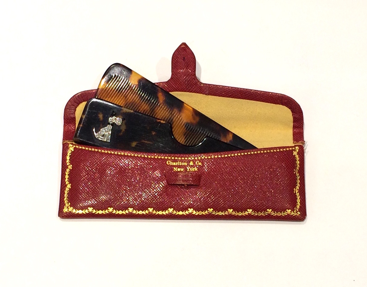 Charlton & Co. New York “Scottie” comb, platinum and diamond “Scottie” highlighted with black enamel set with three baguette diamonds and twelve round diamonds set on a tortoise shell comb and holder, original red leather and suede envelope, signed, c. 1930’s