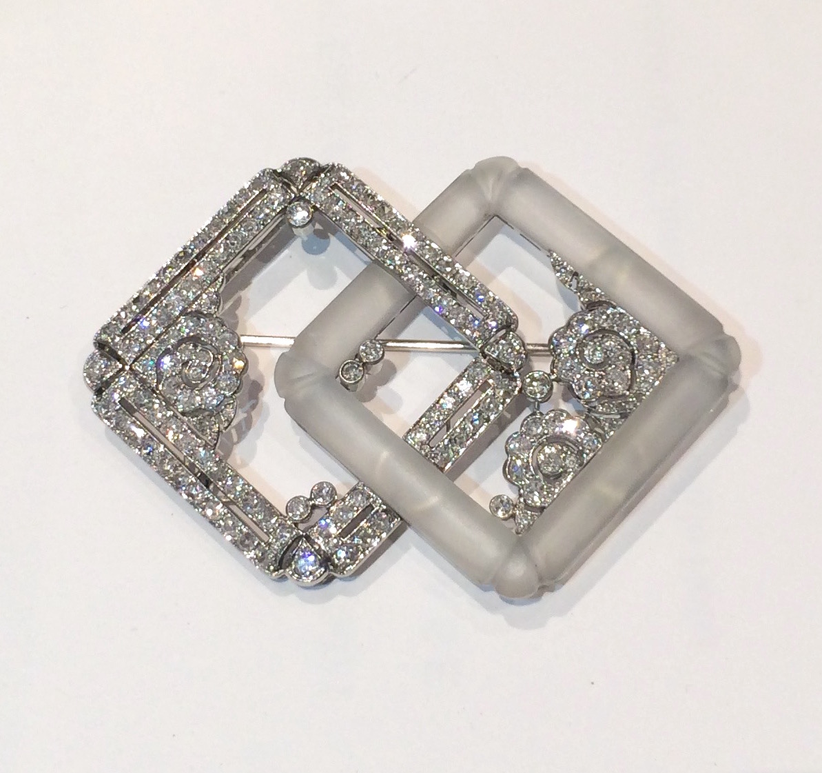 French Art Deco, Fancy “Interlocking Squares” brooch, diamonds and rock crystal set in an openwork platinum mount, marked, c. 1920’s
