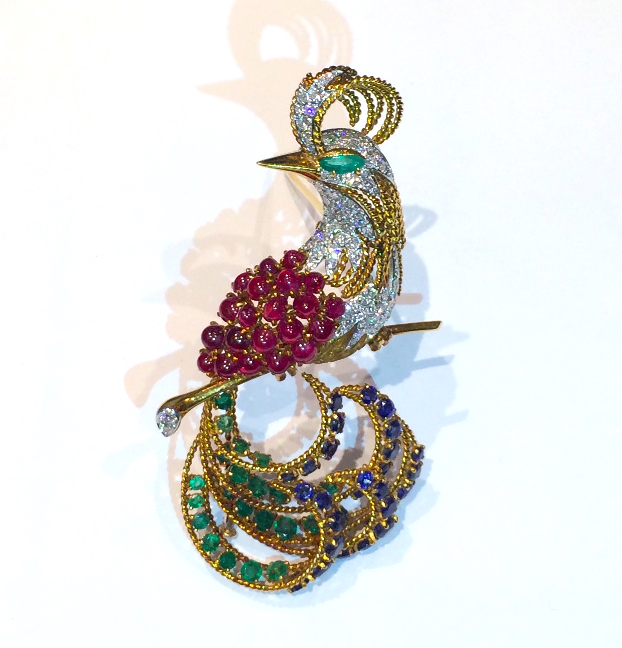 Retro “Bird of Paradise” brooch, 18K yellow gold set with cabochon rubies, emeralds, sapphires and pave diamonds, c. 1940’s