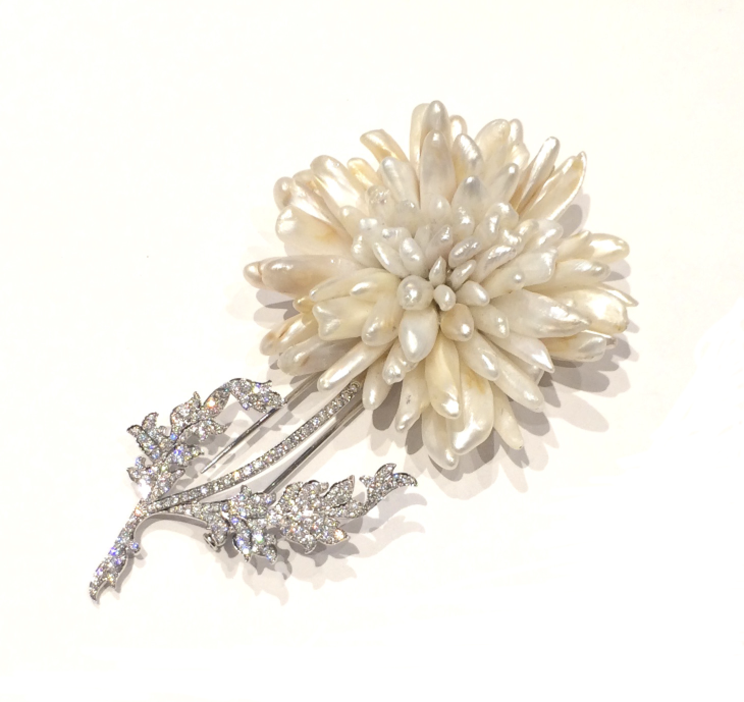 W. Truman Ltd. / Peter Truman for The Goldsmith’s Company “Chrysanthemum” brooch in platinum and diamonds and natural Mississippi pearls, retailed by Tiffany & Co. New York, signed, c. 2000