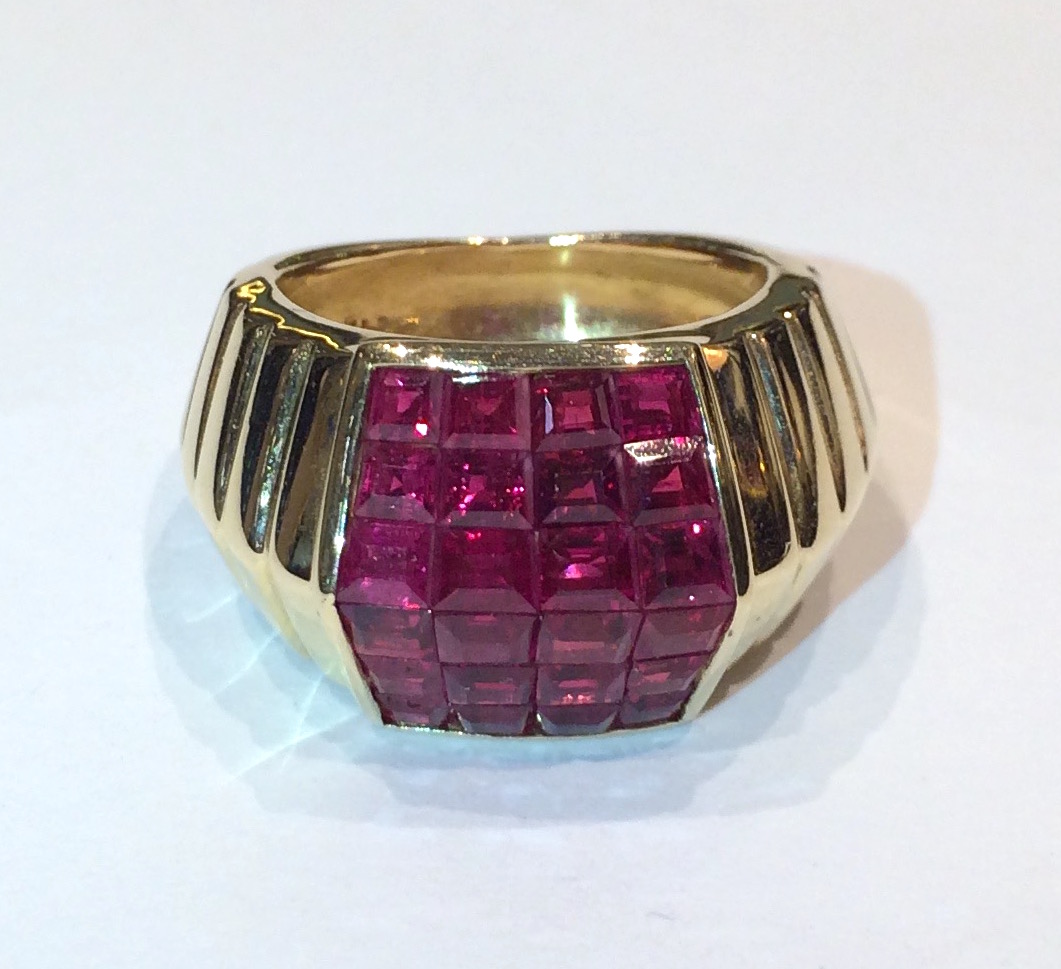 European Art Deco “Chevron” design ring, 18K gold set with 24 square cut invisibly set rubies (approx. 6 carats TW) in a pyramid form, marked, c. 1940’s