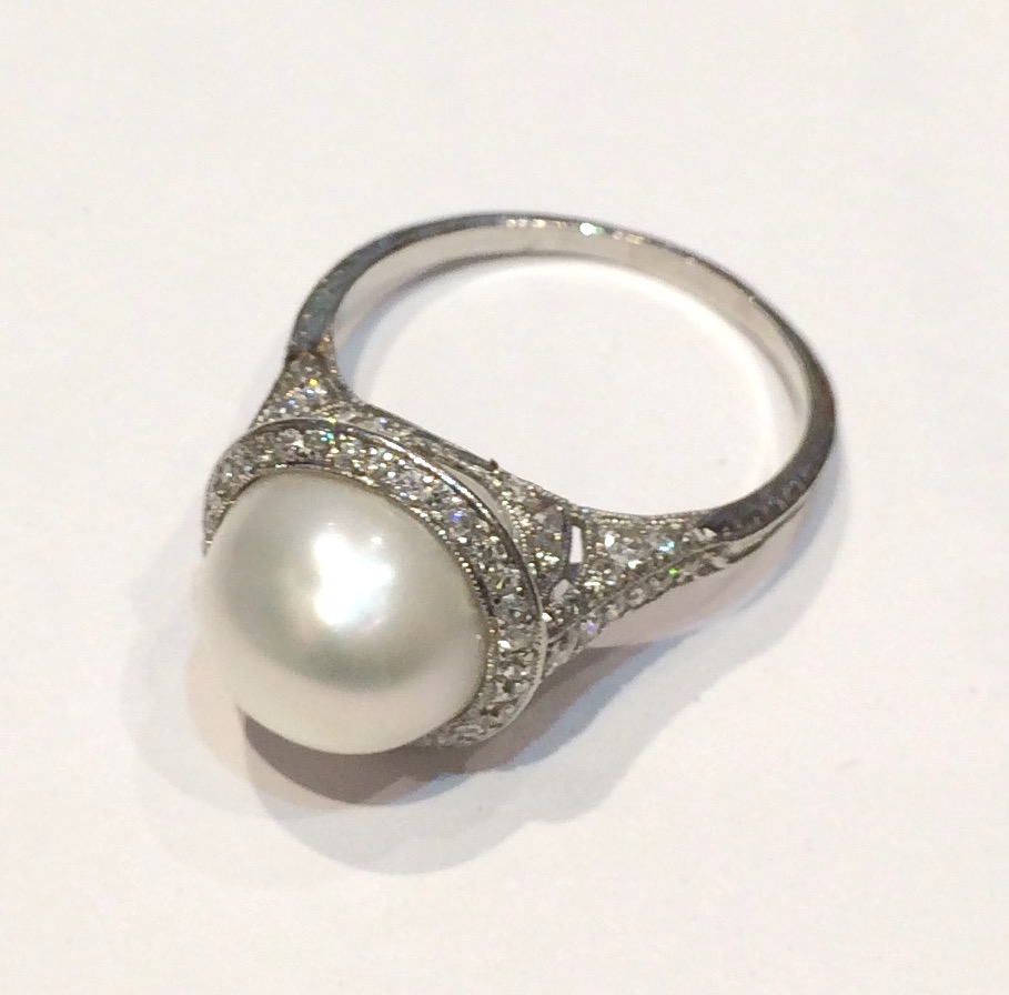 Art Deco “Saturn” ring, freshwater pearl (Mississippi river pearl, certificate) and pave diamonds all set in platinum c. 1920