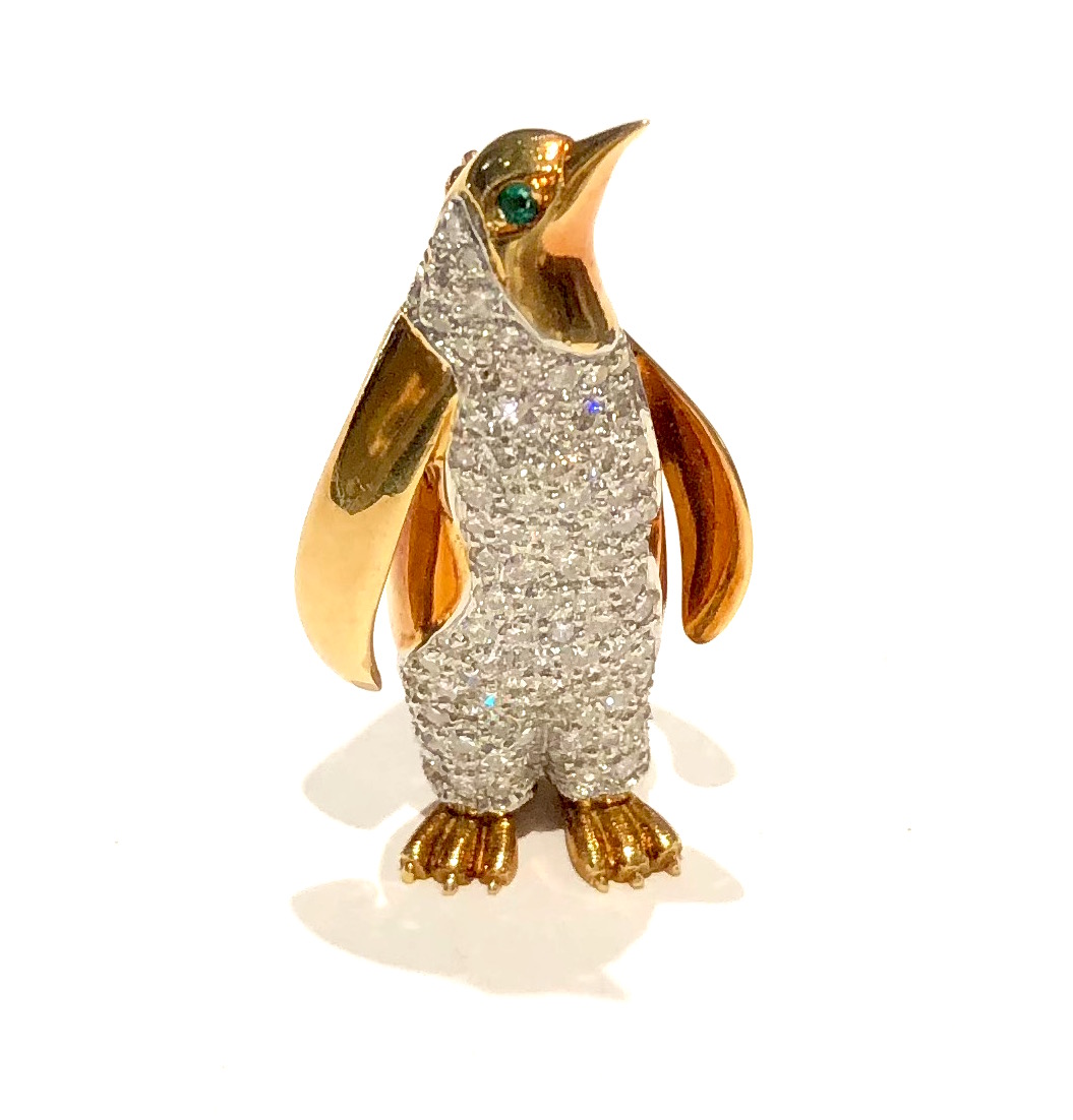 Walter P. McTeigue Penguin brooch, platinum set with pave diamonds (approx. 3 carats TW), 18k gold body further set with two cabochon emerald eyes, signed, c.1940’s