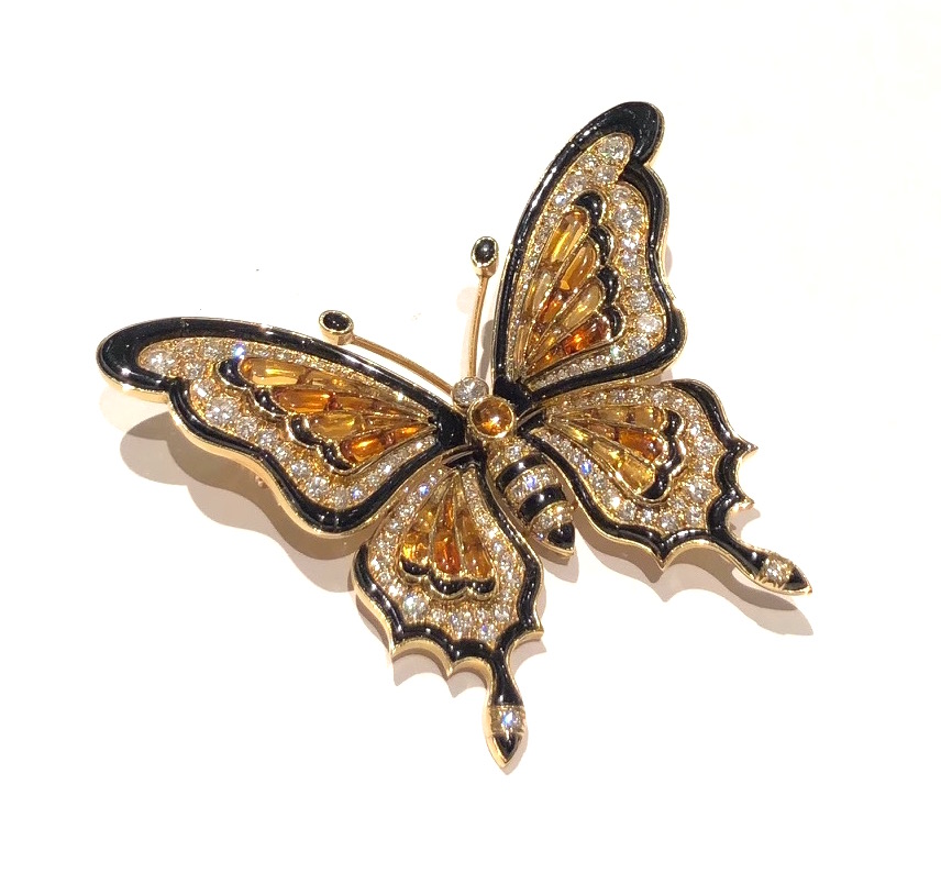 Bulgari, Rome, “Swallowtail Butterfly” brooch, 18k gold with 134 diamonds (approx. 10+ carats TW), 37 buff-cut gold and madeira citrines and buff-cut black onyx set along the edge and as accent details, signed: BVLGARI, original signed brown leather suede and silk lined presentation box, c.1940’s