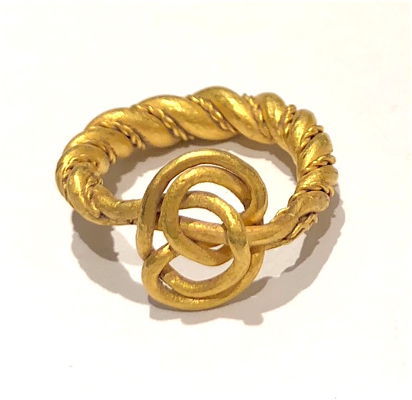 Viking, circa 9th Century AD fancy twisted ring in a high karat gold (22k-24k) with a “Lover’s Knot” as the central featured motif