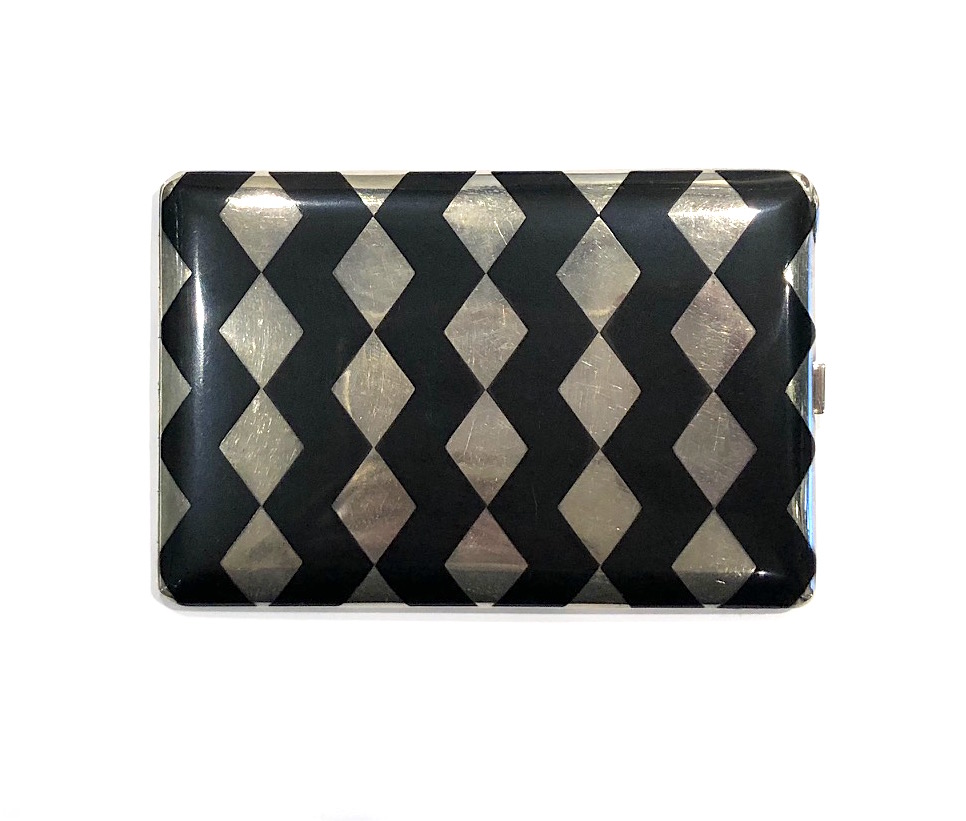 Paul Brandt, Paris Art Deco “Zig Zag” cigarette case in sterling with champlevé black enamel zig zags on both sides of the case, signed: S A M initials in a triangle French maker’s poincon, French Boar’s head Paris silver assay mark for small objects (2x), London import mark with a London Zodiac sign of Leo (3x), .925 (silver standard) (4x) and the London letter M date mark for 1927 (3x), no. 18347 (2x), British touchmark of a G and an F in a rectangle, C.B.F initials and the date 7-1928 (script engraving), c.1925