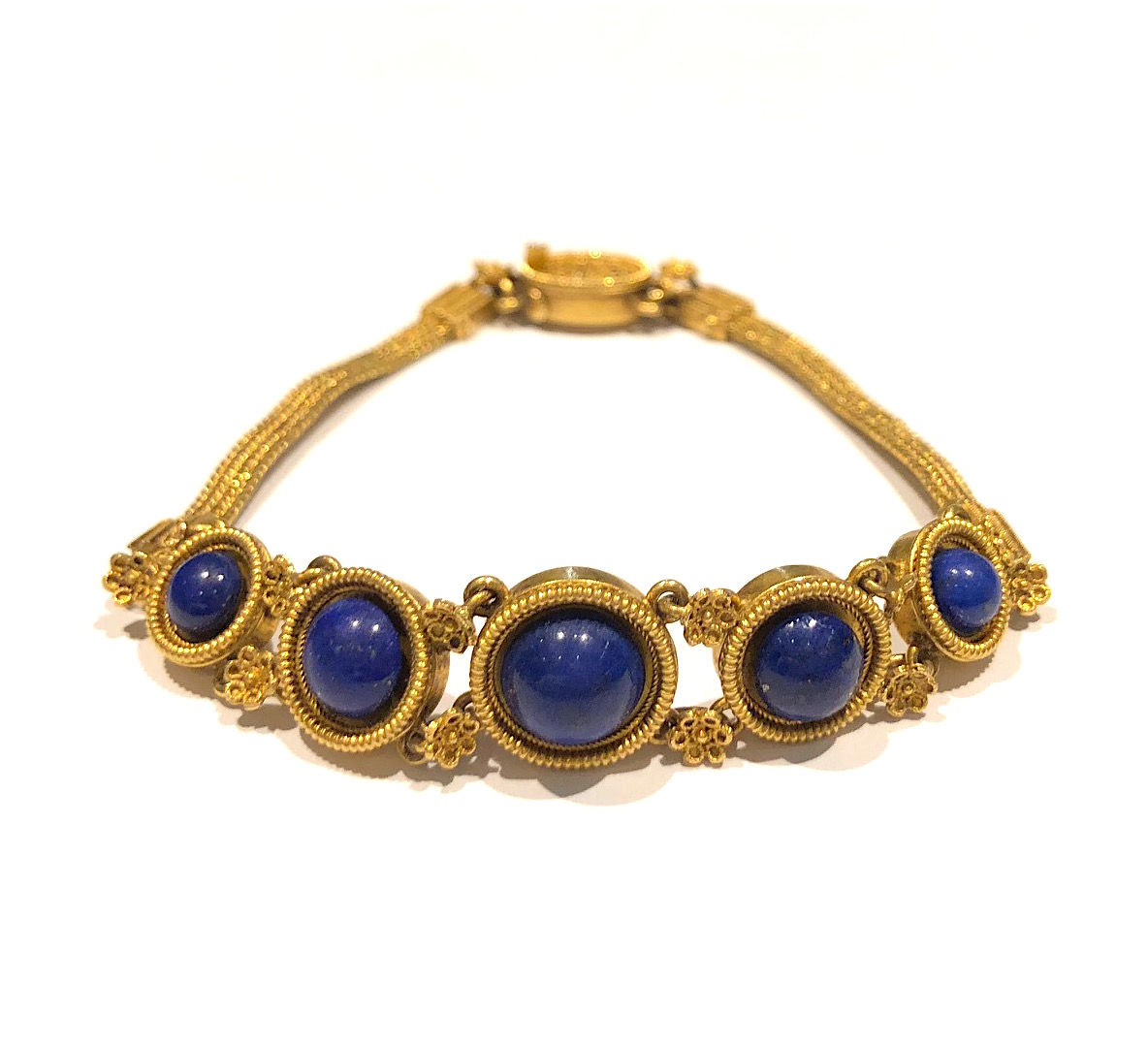 Giacinto Melillo (attr.) Etruscan / Egyptian Revival bracelet, finely woven three strand 18K gold braclelet set with very delicate floral rosettes throughout with fine wire work and gold granulation and further set with 5 round cabochons of gem quality lapis lazuli, c.1875