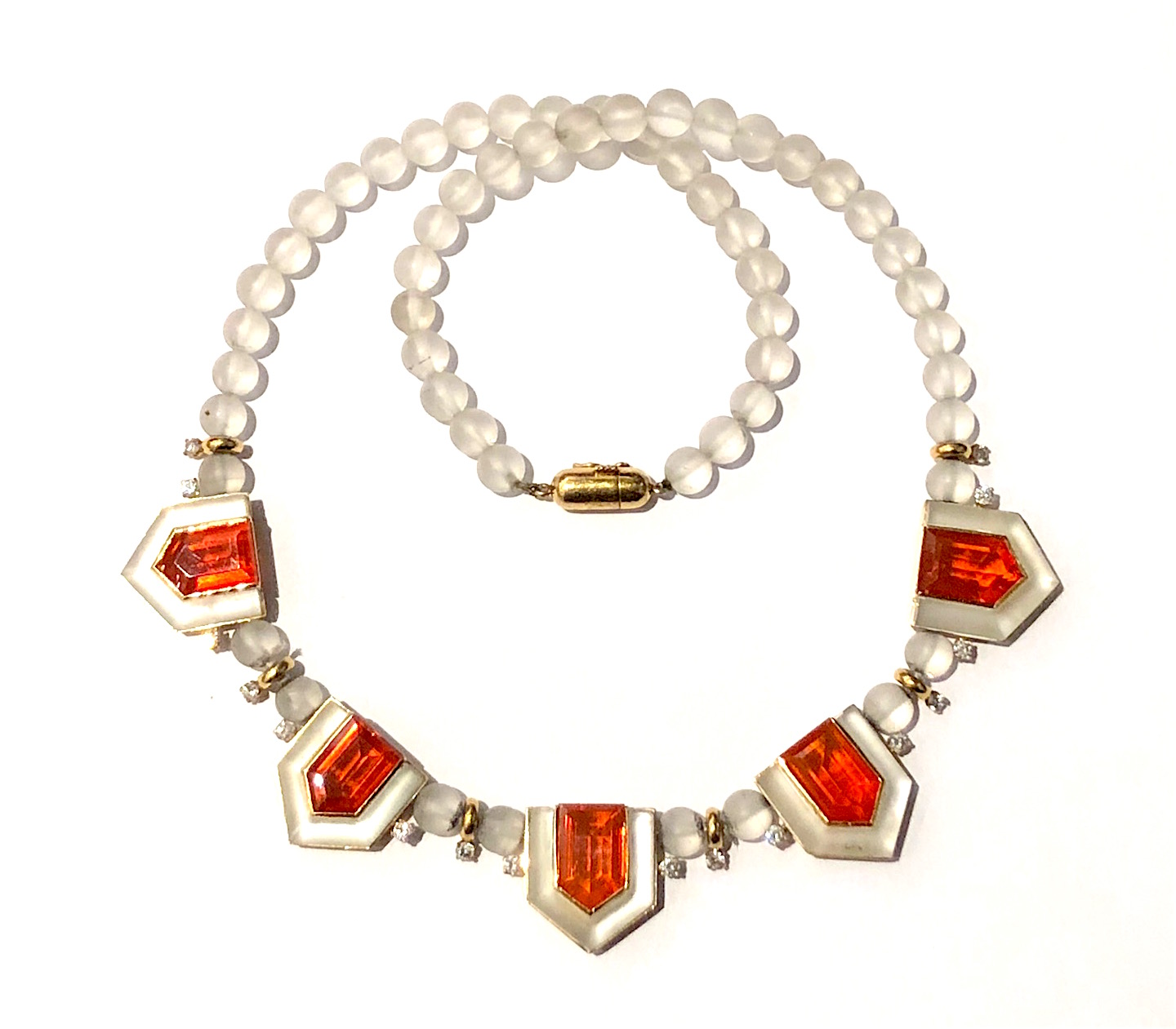 Art Deco “Fire Opal” necklace, frosted rock crystal round beads and four sided custom rock crystal bezels set in 18K yellow gold with 16 round–cut accent diamonds featuring five large natural fire opals (G.I.A certificate, dimension of each fire opal, 13.00 x 8.15 x 6.20mm for a TW of approx. 17.50 carats), c. 1940’s