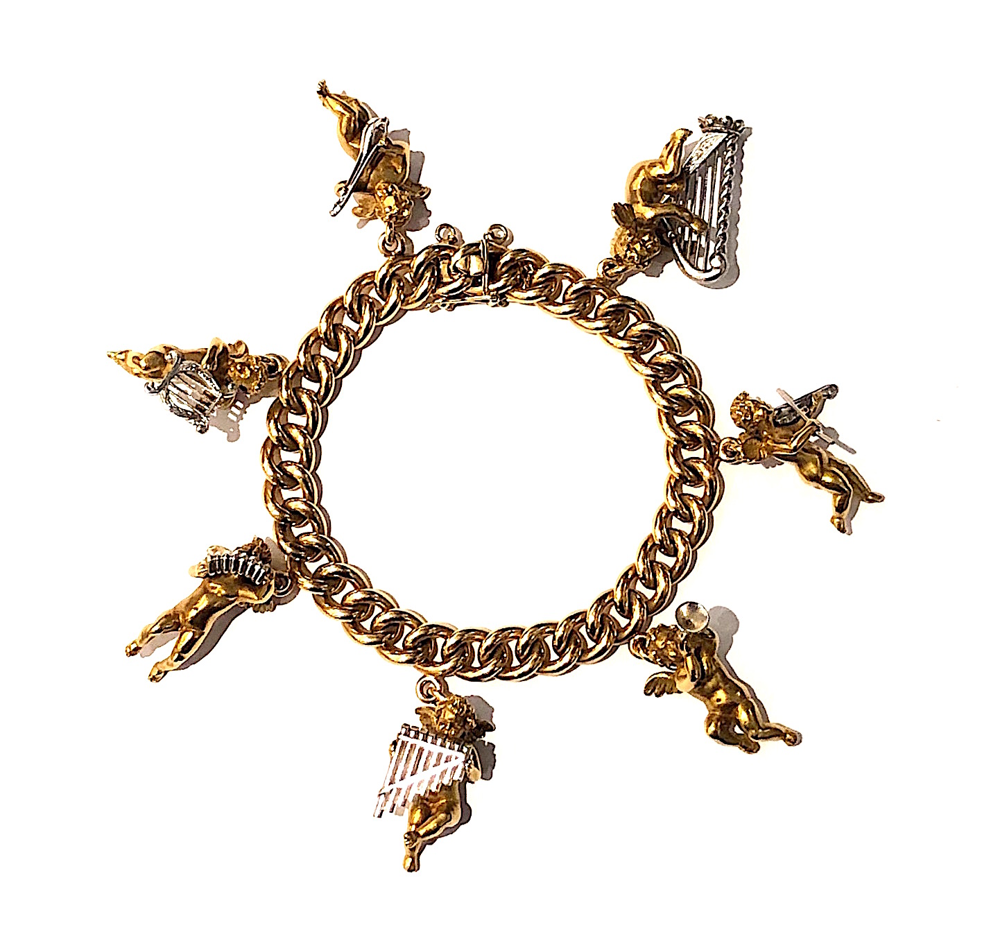 Enrico Serafini, (1913-1968) Italy “Cupid Orchestra” charm bracelet, 18k gold finely detailed cupid figures playing a variety of musical instruments in platinum all on a solid 18k gold link bracelet, touchmark,c.1950