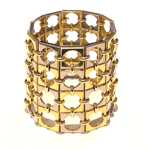 Weber & Cie, Geneva Switzerland (1842-2017) “Mod” or “Op Art” bracelet that forms a tapered cuff with a repeat circle in a square motif in alternating 18k yellow and white gold sections that are further joined with strapwork and give the visual impression of a woven surface, marked: maker’s mark of AW (A. Weber) intersecting initials in an oval cartouche, 750 (18k gold mark), Swiss Made, 18k, c.1960’s