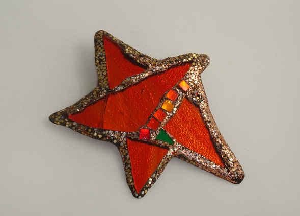 Andrew Logan  “Red Star” brooch, iridescent red/orange mirror sparkle dust and resin, signed, c. 1990’s
