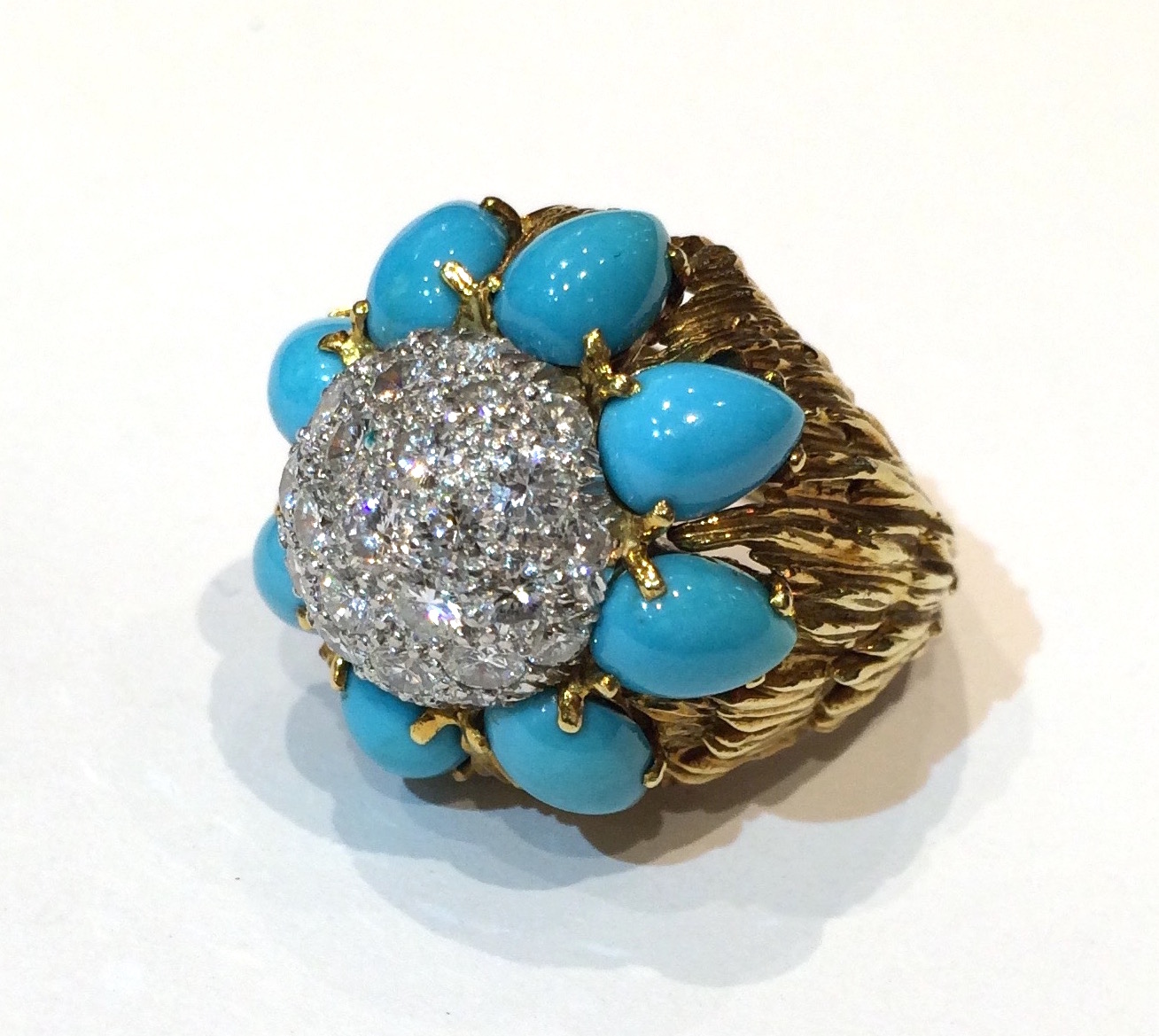 Verdura, Highly textured 18K gold ring set with teardrop shaped turquoises and a convex center of pave diamonds, marked, c. 1950