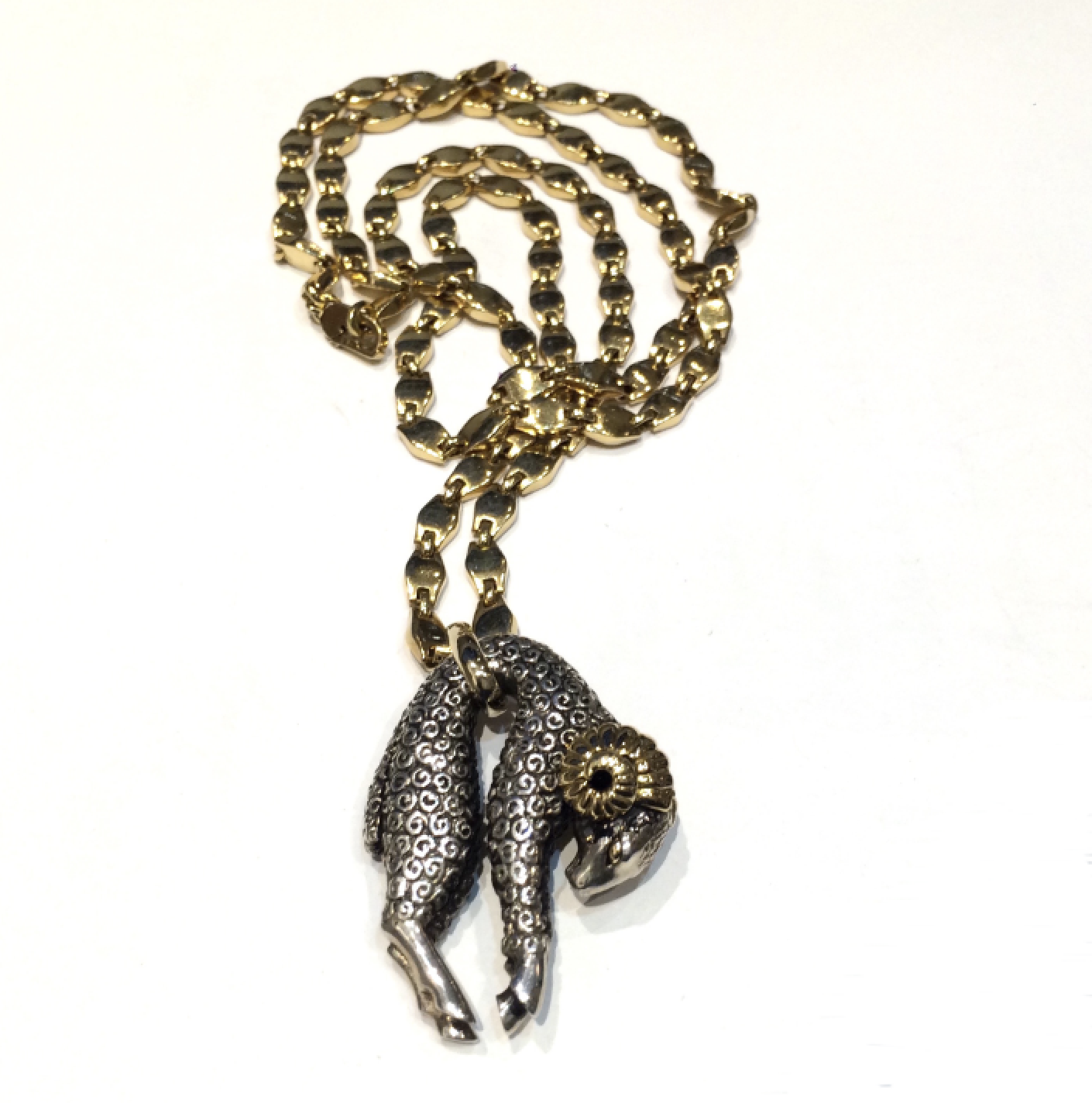 Cartier “Order of the Golden Fleece” pendant necklace with an 18K gold and silver ram, matching Cartier 18K gold chain, signed, c. 1970’s