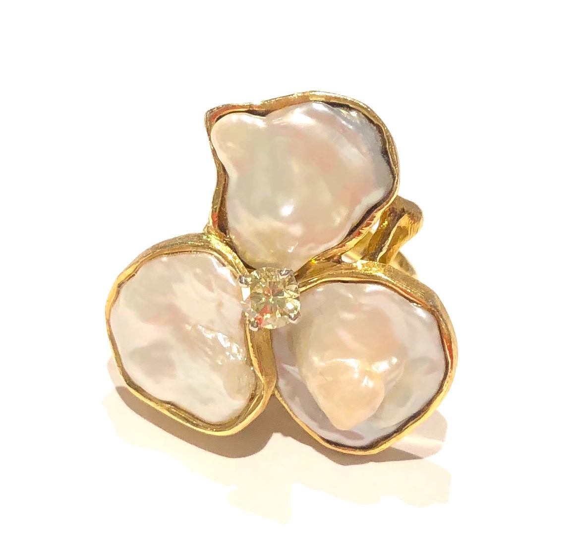 William Ruser, Beverly Hills “Lotus Blossom” ring set with three large natural Baroque pearls and a yellow diamond in the center (approx. .50 carats by calculation) in an 18k gold highly textured structural gold mount, signed: R (for Ruser), 18k, c.1960